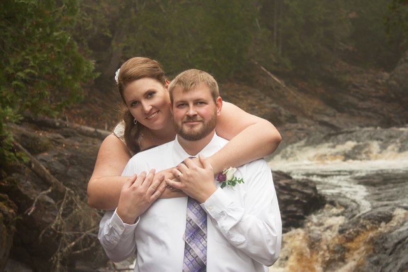 photo of a couple in front of a river