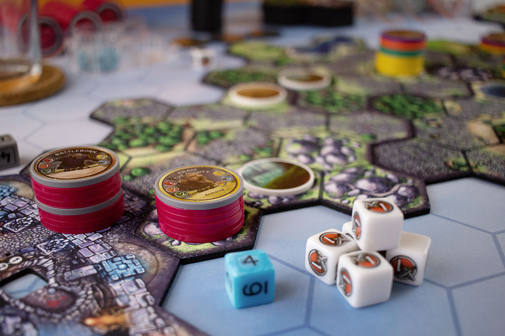 closeup of chips and dice from the board game Cloudspire