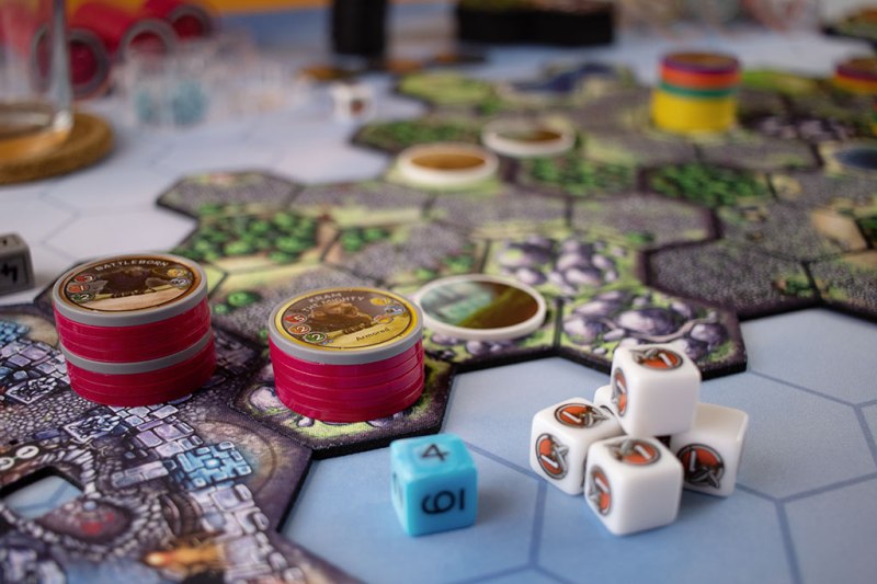 closeup of chips and dice from the board game Cloudspire